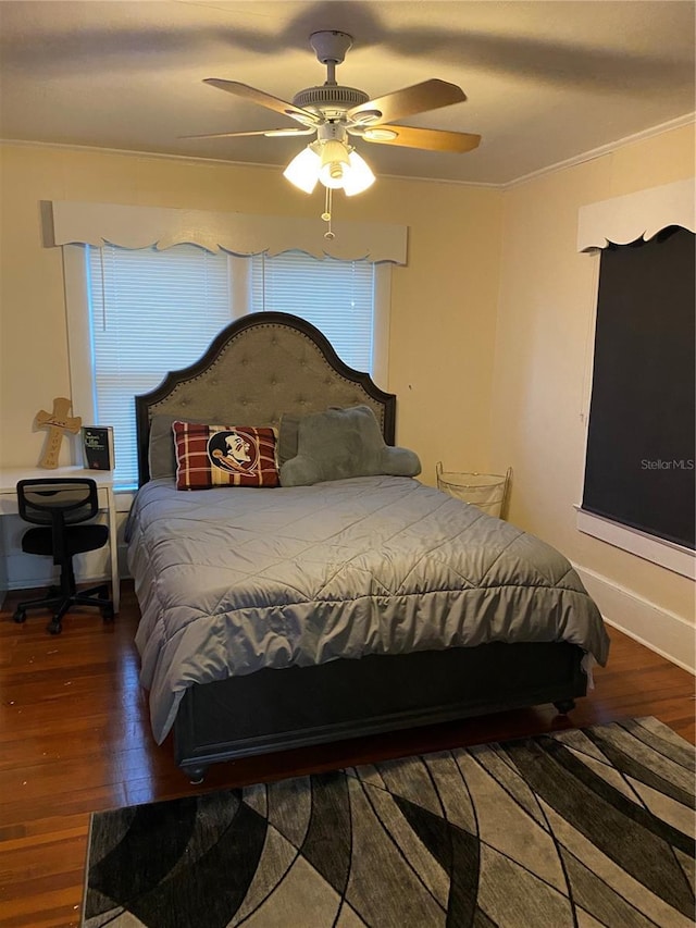 bedroom featuring a ceiling fan and wood finished floors