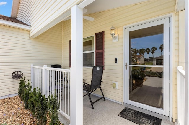 view of exterior entry featuring a porch