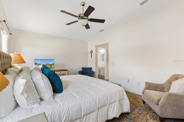 bedroom featuring visible vents, wood finished floors, ensuite bathroom, high vaulted ceiling, and a ceiling fan