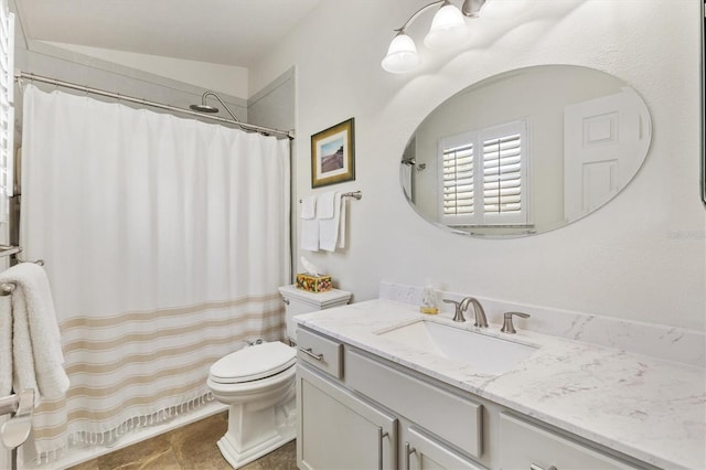 bathroom with toilet, curtained shower, and vanity