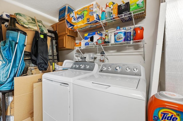 washroom featuring washer and dryer and laundry area