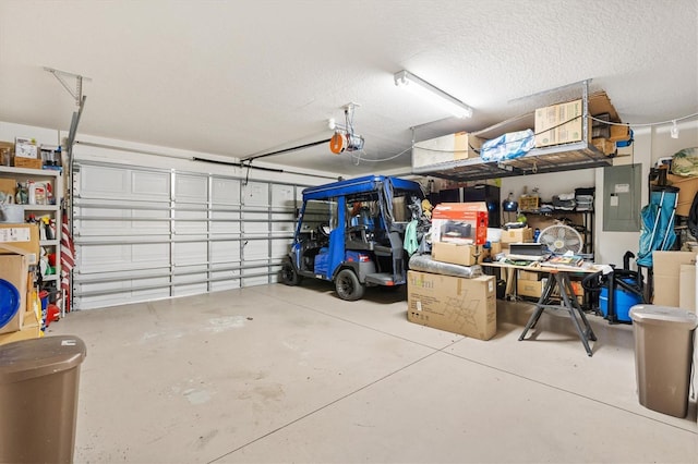 garage featuring a garage door opener and electric panel