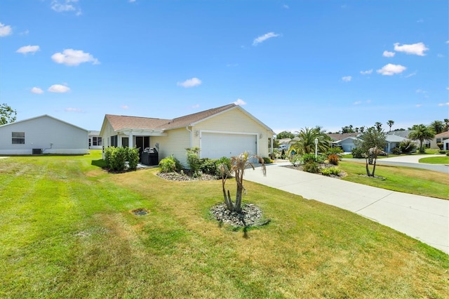 single story home featuring a garage, a front yard, and concrete driveway