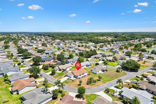 birds eye view of property with a residential view