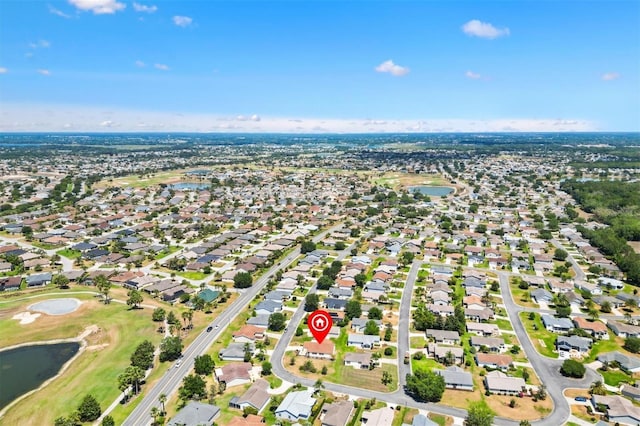 birds eye view of property with a residential view, a water view, and golf course view