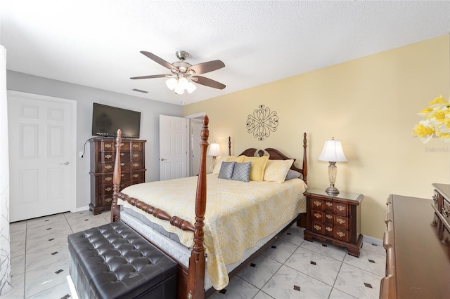 bedroom featuring visible vents, baseboards, and ceiling fan