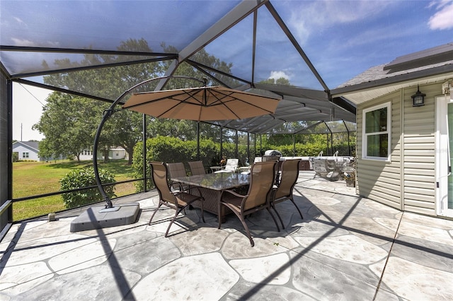 view of patio / terrace with a lanai and outdoor dining area