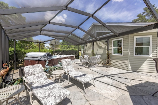 view of patio featuring outdoor dining area, a hot tub, a lanai, and grilling area