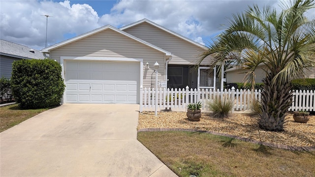 single story home with fence, an attached garage, and concrete driveway
