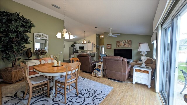 dining space featuring visible vents, a wealth of natural light, and light wood-type flooring