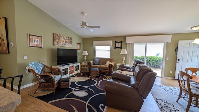 living room featuring baseboards, a ceiling fan, lofted ceiling, and wood finished floors