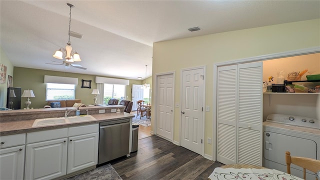 kitchen with washer / clothes dryer, dishwasher, a sink, a notable chandelier, and open floor plan