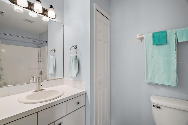 full bathroom with a closet, visible vents, toilet, and vanity