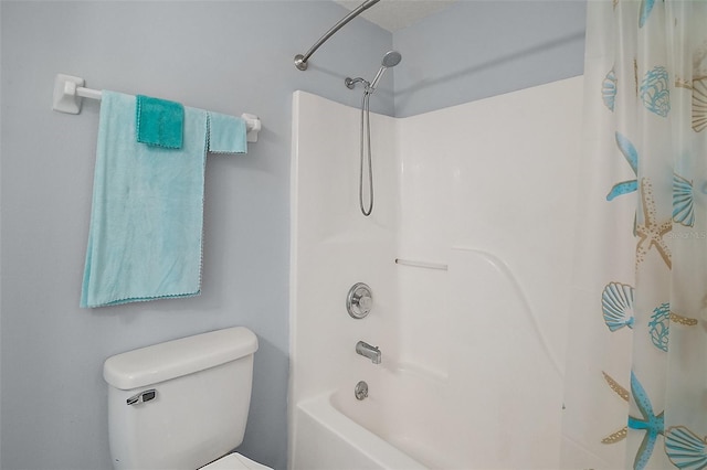 bathroom with shower / bath combo with shower curtain and toilet