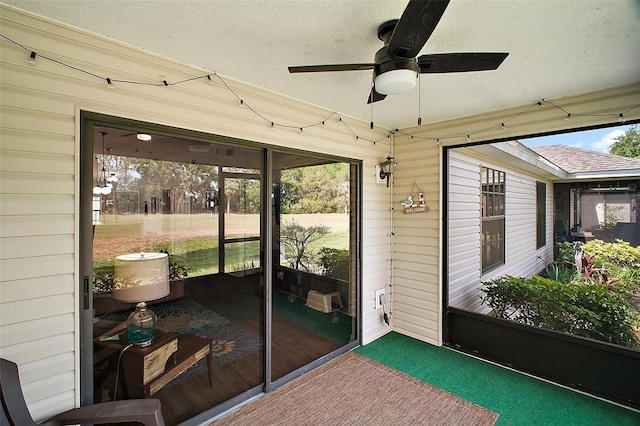 sunroom featuring a ceiling fan