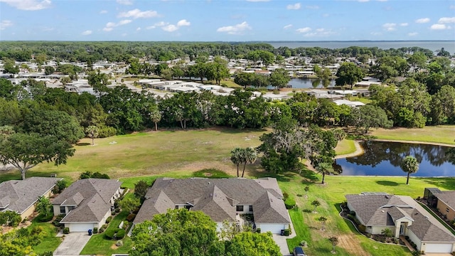 drone / aerial view featuring a residential view and a water view
