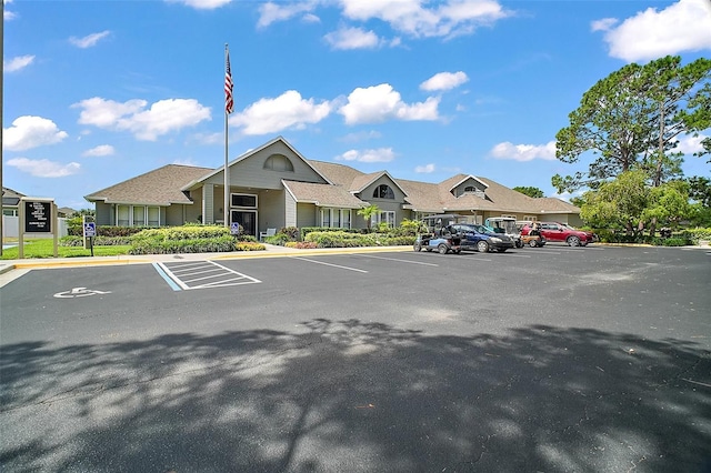 view of property with uncovered parking