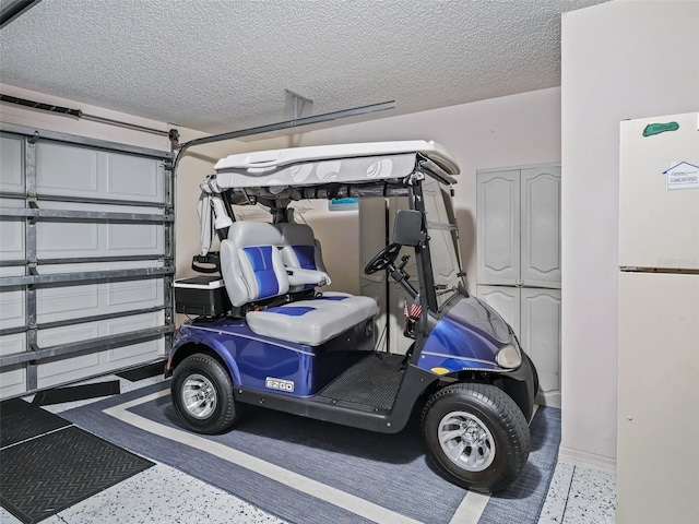 garage with freestanding refrigerator