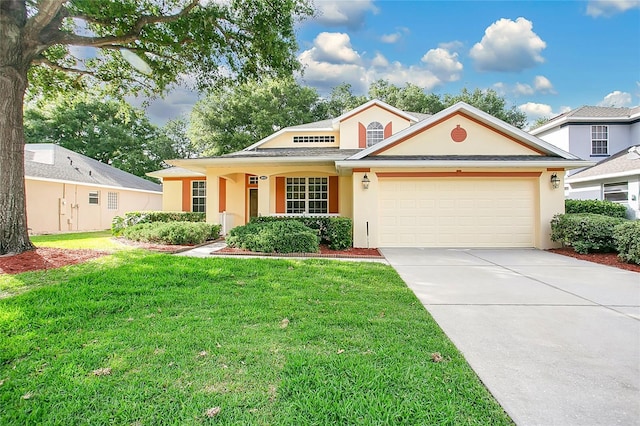 view of front of house with concrete driveway, an attached garage, stucco siding, and a front yard
