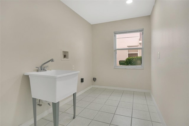 washroom featuring laundry area, washer hookup, baseboards, light tile patterned flooring, and recessed lighting