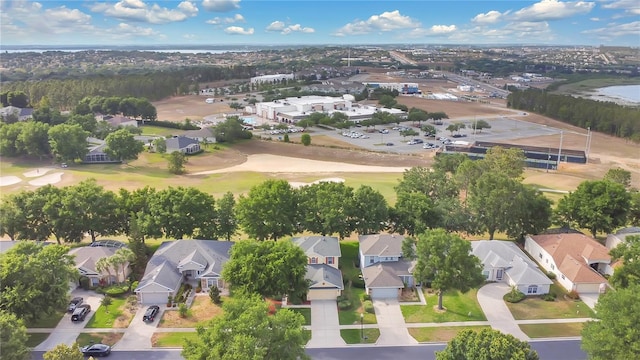 birds eye view of property featuring a residential view and view of golf course