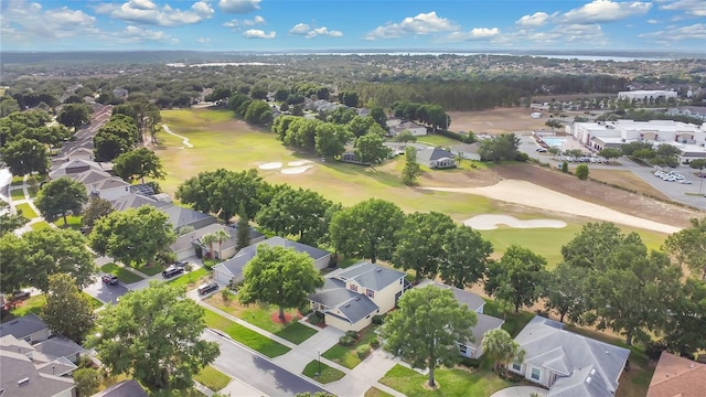birds eye view of property featuring golf course view and a residential view