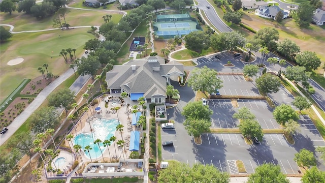 birds eye view of property with view of golf course