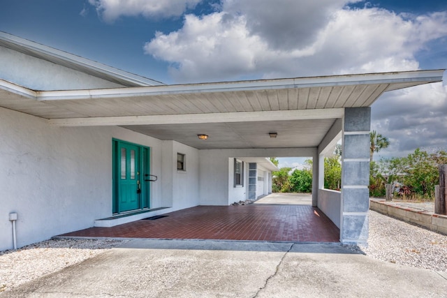 exterior space featuring an attached carport