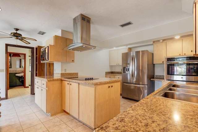 kitchen with light brown cabinetry, ceiling fan, stainless steel appliances, light tile patterned floors, and island range hood