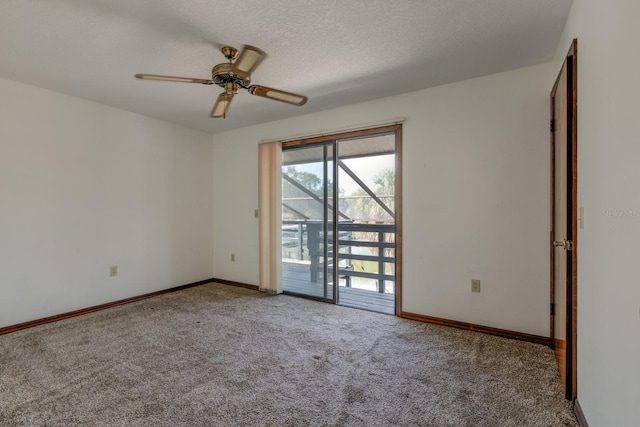 unfurnished room with baseboards, a ceiling fan, carpet flooring, and a textured ceiling