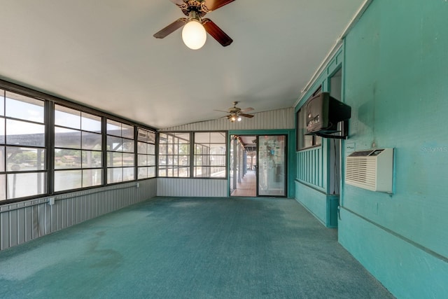 unfurnished sunroom with a wall mounted AC and a ceiling fan