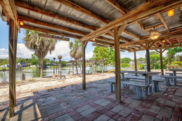 view of patio with a water view