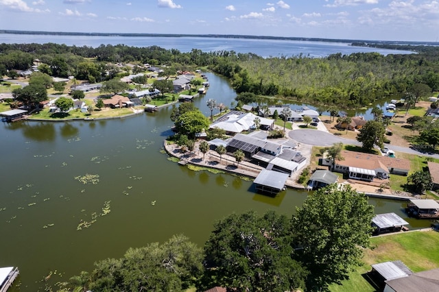 drone / aerial view with a residential view and a water view