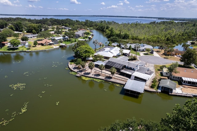 drone / aerial view featuring a water view and a residential view