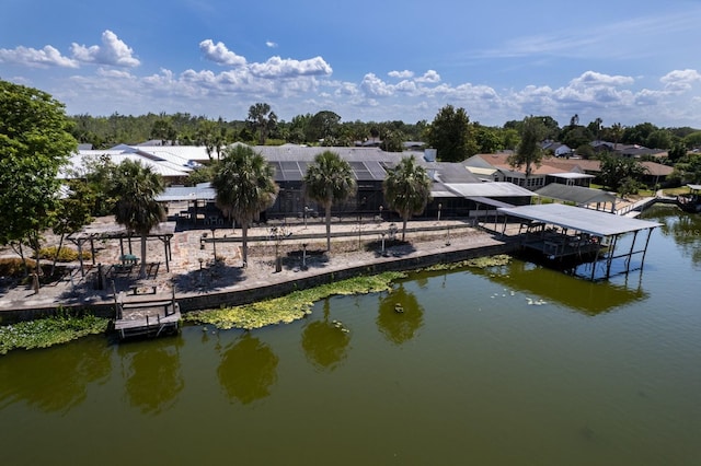 view of dock with boat lift and a water view