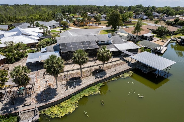drone / aerial view featuring a water view and a residential view