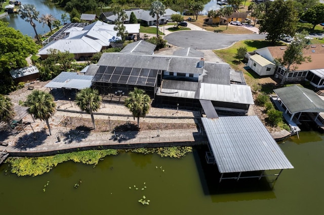 bird's eye view featuring a water view and a residential view