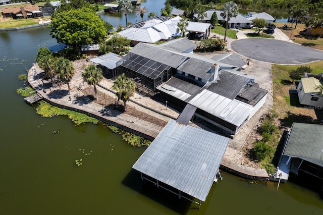 bird's eye view with a water view and a residential view