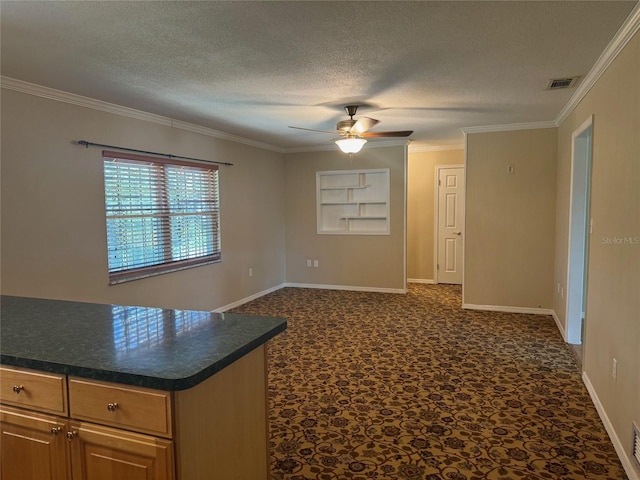 unfurnished room featuring a textured ceiling, a ceiling fan, baseboards, visible vents, and ornamental molding