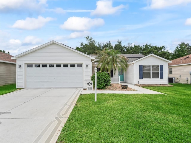 ranch-style home featuring driveway, solar panels, central AC, and a front yard