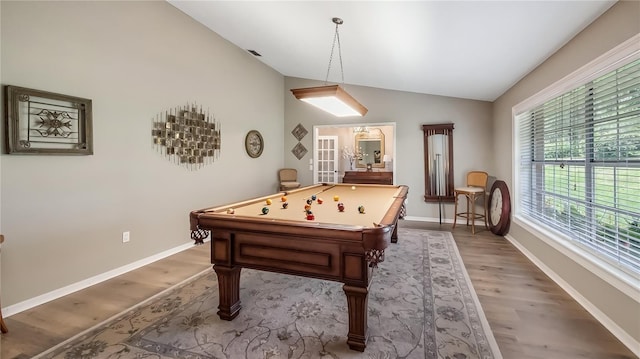 recreation room with billiards, baseboards, vaulted ceiling, and light wood-style flooring