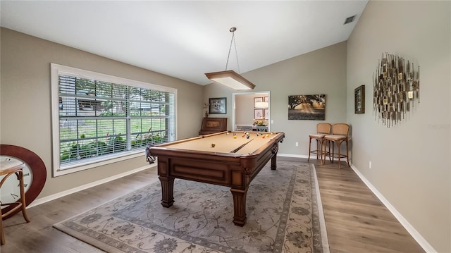 recreation room featuring pool table, baseboards, vaulted ceiling, light wood-type flooring, and visible vents