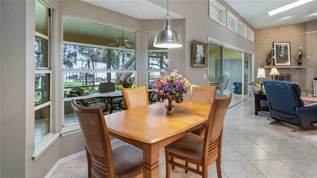 dining area featuring a ceiling fan and light tile patterned flooring