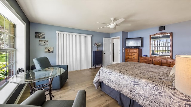 bedroom featuring a ceiling fan and wood finished floors
