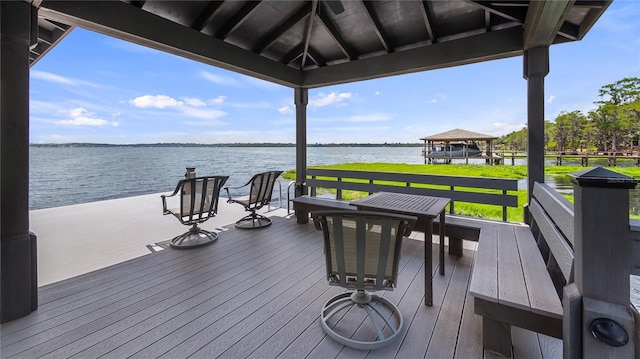 wooden deck with a gazebo and a water view
