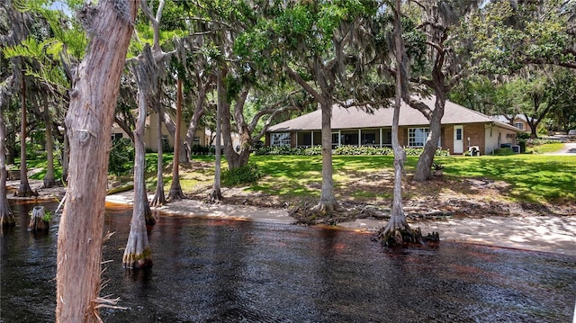 12104 Elbert St, Clermont, FL 34711 - dock area featuring a yard and a water view
