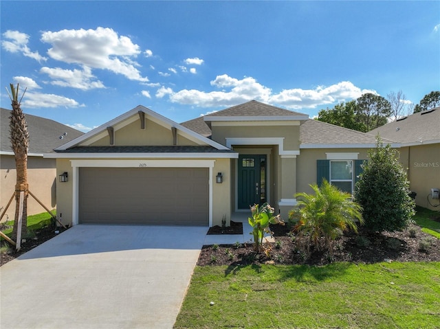 view of front of house featuring stucco siding, an attached garage, concrete driveway, and a front lawn