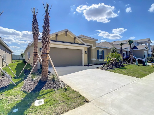 ranch-style house featuring stucco siding, an attached garage, driveway, a front yard, and a residential view