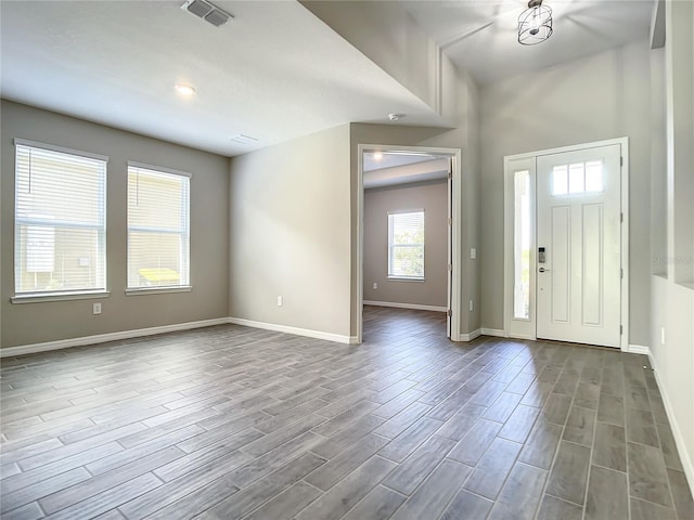 entrance foyer featuring dark wood-type flooring and baseboards
