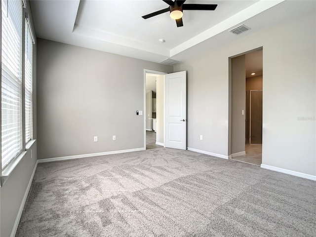 unfurnished bedroom with carpet floors and baseboards